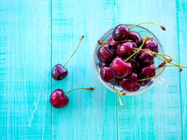 Cherries. Cherry. Cherries In Color Bowl And Kitchen Napkin. Red