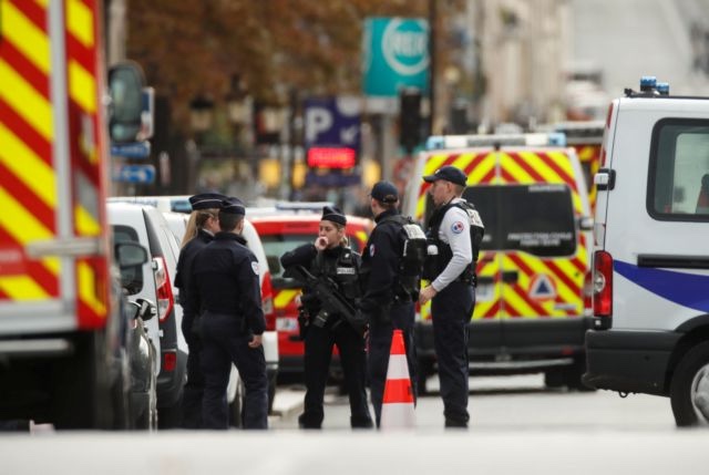 French police is seen in front of the Paris Police headquarters in Paris